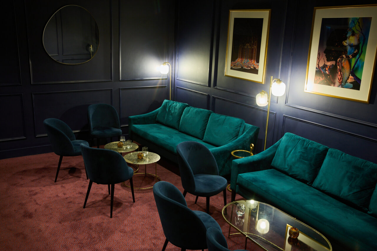 Adelaide's Bar at the London Coliseum - a cosy bar space with plush sofas and soft lighting.