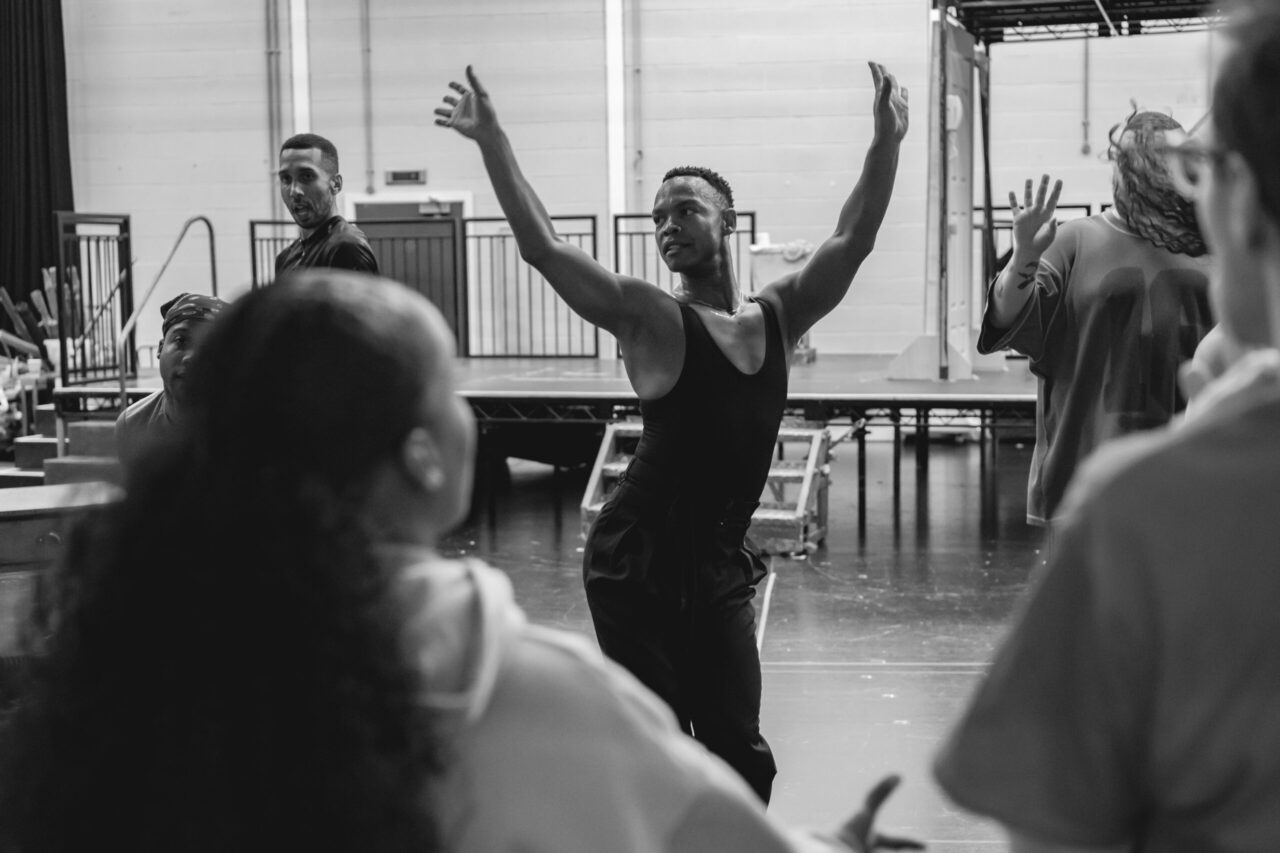 Johannes Radebe Centre Stage in Rehearsal. credit Matt Crockett