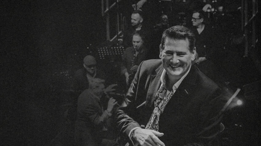 Image of Tony Hadley in front of Big Band