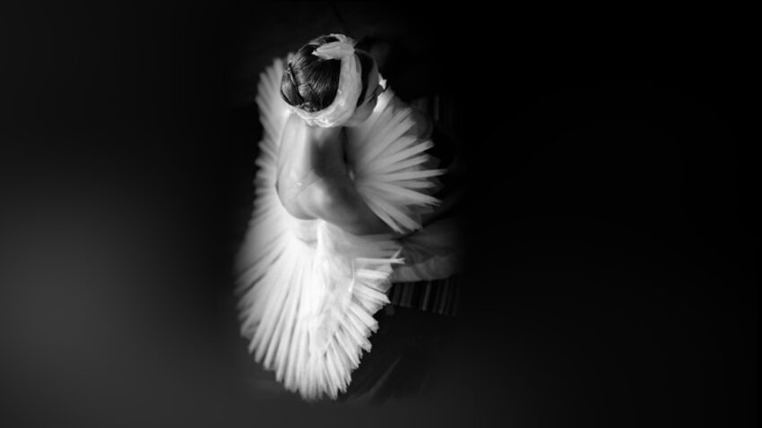 Black and white overhead image of a ballet dancer