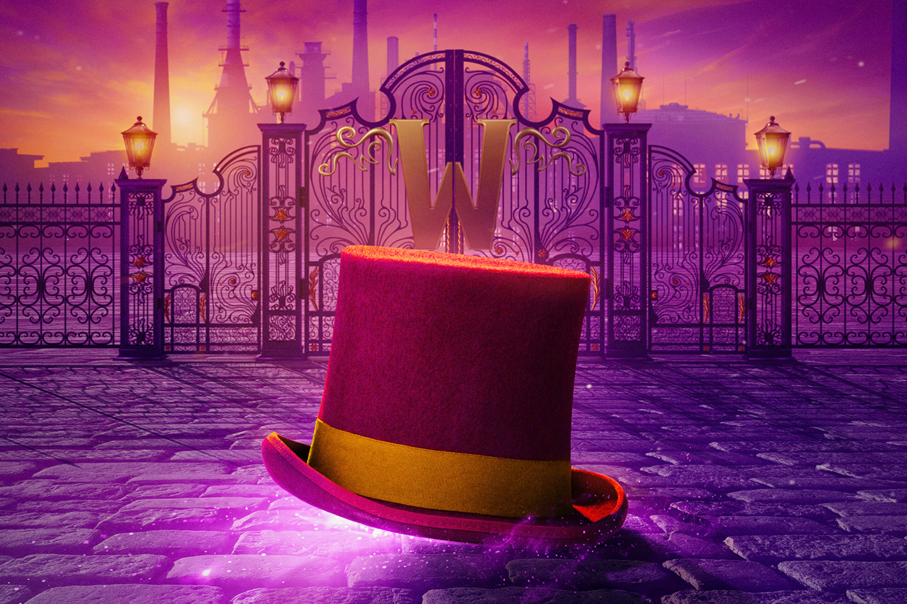 Image of a purple top hat in front of closed factory gates with a large gold W on the front of them - Lead image for CHARLIE AND THE CHOCOLATE FACTORY THE MUSICAL at the London Coliseum